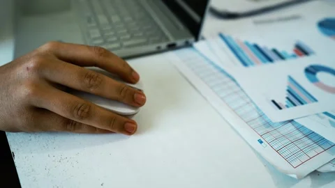 Business Analysis with Graphs and Laptop, A close-up view of a laptop keybo.. 動画素材 304977987