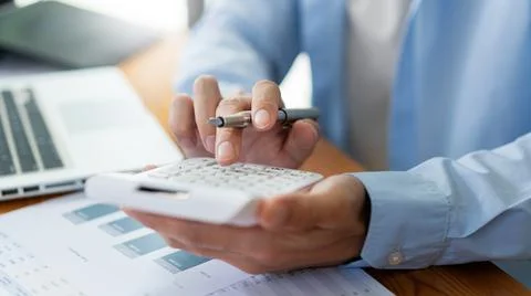 Business analyst concept the accountant looking at the information on the com Stock Photos