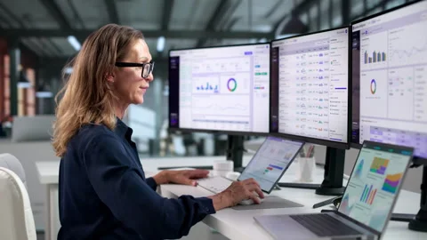 Business Analyst Explores Interactive Dashboards Using Laptop Stock Footage 347289477