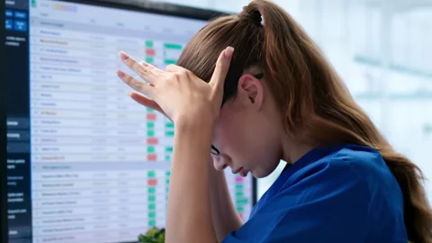 Business Analyst Feeling Stressed While Coding Financial Reports Stock Footage 345330030
