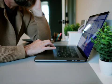 Business Analyst Sorting Through Graphs and Charts Stock Photos