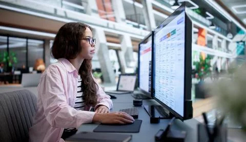 Business Analyst Studies Live Dashboard On Computer For Crisis Response. Stock Photos