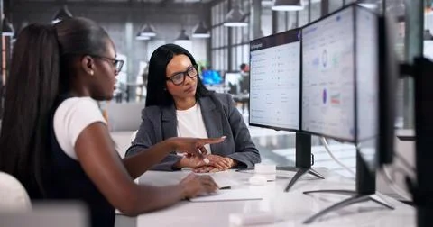 Business Analysts Collaborate On Computer To Assess Strategic Risk Management Stock Photos