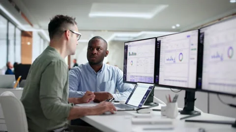 Business Analysts Collaborate On Interactive Dashboards, Exploring Data Stock Footage 346321317