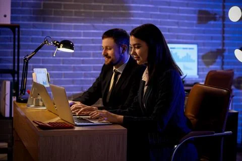 Business analysts working with laptops at table in office. Data science conce Stock Photos