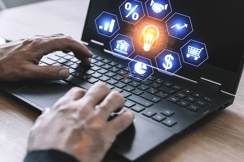 Business analytics and technology analysis concept. A manager uses a computer to Stock Photos