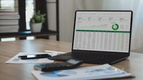 Business analytics dashboard displayed on a laptop with financial charts, s.. Stock Photos