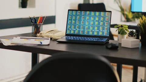 Business analytics files and notebook on desk in company workplace Stock Photos