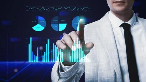 Business analytics. Man and virtual screen with graphs on color background, c Stock Photos