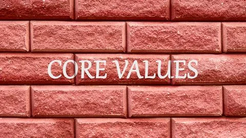 Business and core values concept on the red decorative brick wall Stockfoto's