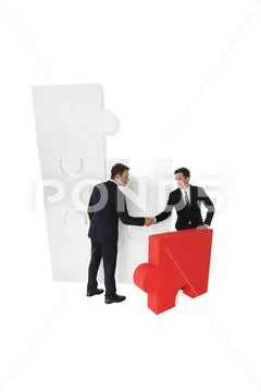 Business and final piece of puzzle Stock Photos