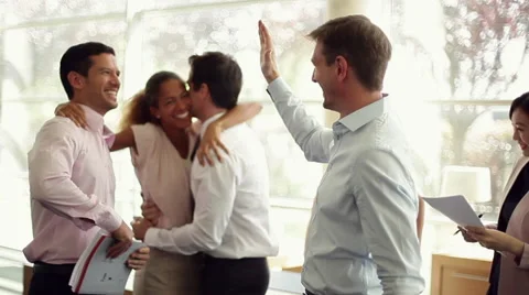 Business associates congratulating each other Stock Footage