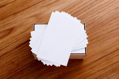 Business card blank stack mockup with kraft box on wood desk Stock Photos