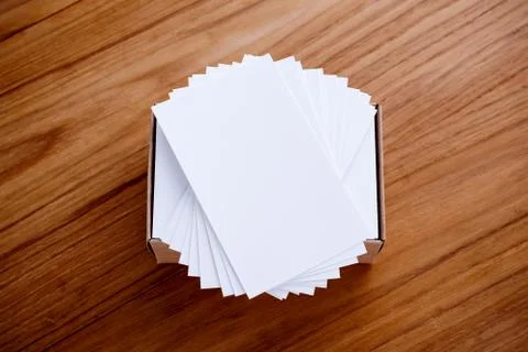 Business card blank stack mockup with kraft box on wood desk Stock Photos