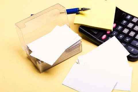 Business cards with empty space in box and sticky notes. Stock Photos