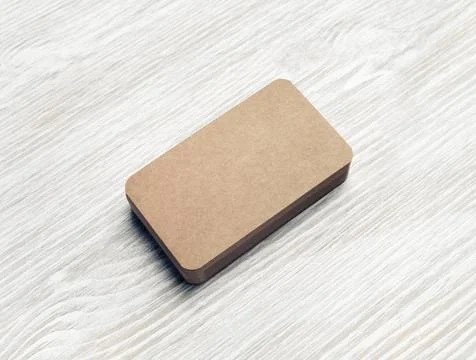 Business cards stack Blank kraft business cards stack on light wooden back... Foto stock
