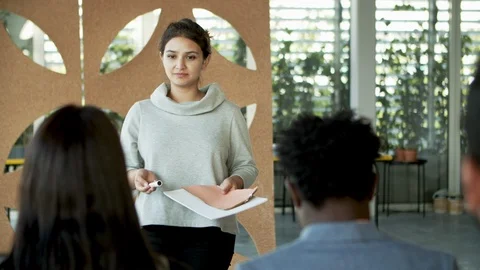 Business coach explaining new material to employees Stock-Footage 119977912