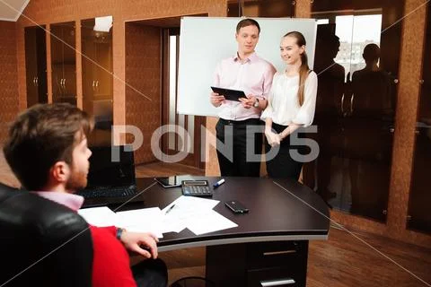 Business coach holding training for staff in the office. Stock Photos