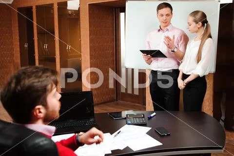 Business coach holding training for staff in the office. Stock Photos