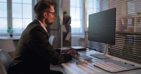 Business coder working on computer in bright corporate office interior workspace Stock Footage 331832374