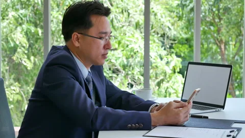 Business colleague working together using smartphone searching website and blogs Video stock 267778209