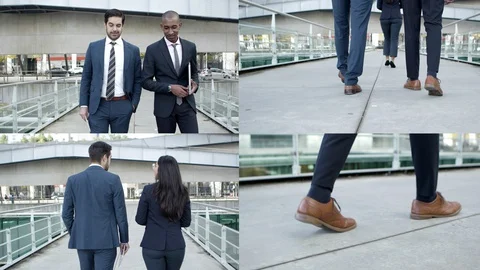 Business colleagues discussing project while walking Stock Footage 130017917