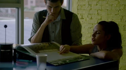 Business colleagues discussing while working together in office Stock Footage 75453036