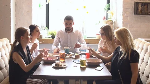 Business Colleagues Eating Meal Together While Discussing of Work. Stock Footage