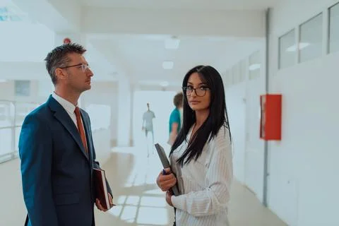 Business colleagues engage in a knowledge-sharing Stock Photos