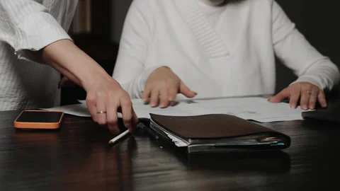 Business colleagues exchanging documents during office work. 스톡 동영상 347814859