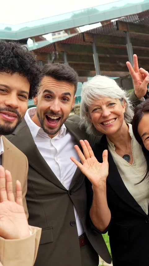 Business colleagues gesturing success while taking selfie together outdoors Stock Footage 292616164
