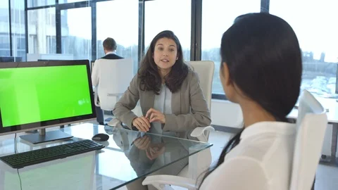 Business colleagues green screen computer on desk, having a discussion in office Stock Footage 108215907
