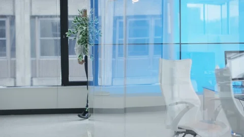 Business colleagues interacting while walking in office corridor Video stock 108134403