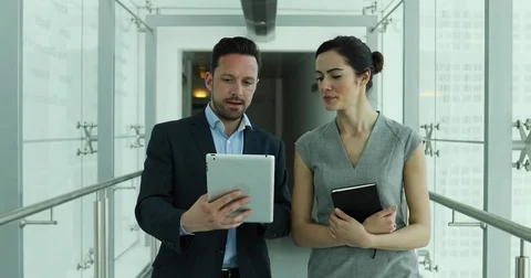 Business colleagues looking at digital tablet together 스톡 동영상 74861374