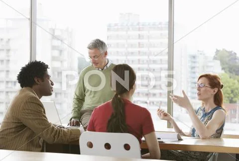 Business Colleagues At Meeting Stock Photos