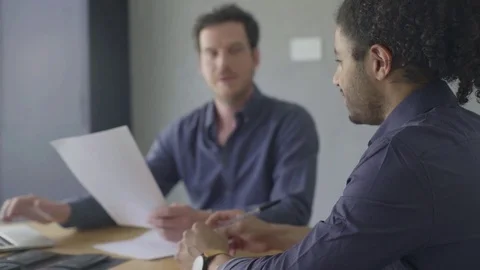 Business colleagues reading document Video stock 75172408