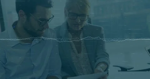 Business colleagues reviewing documents with data processing animation over them Stock Footage 304195029