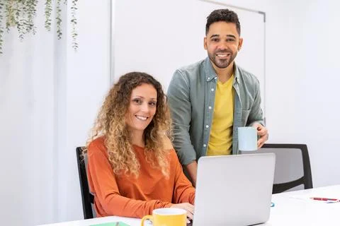 Business colleagues smiling while working together in the office. Foto stock