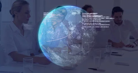Business colleagues taking notes at table while Earth hologram rising with code Stock Footage 311902163