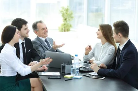 Business colleagues talking at Desk in the office Stock Photos
