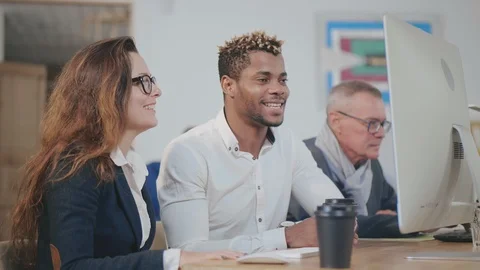 Business colleagues testing new software on computer in office Stock Footage 121141861