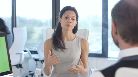 Business colleagues using a computer with green screen while having a discussion Stock Footage 108211082