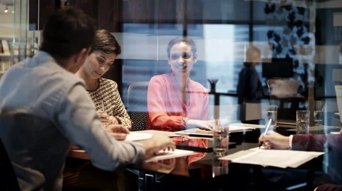 Business colleagues using computer in a meeting at office. Stock Footage 62423235
