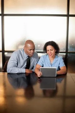 Business colleagues using digital tablet Stock Photos