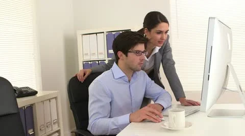 Business colleagues working on the computer Video stock 21377055