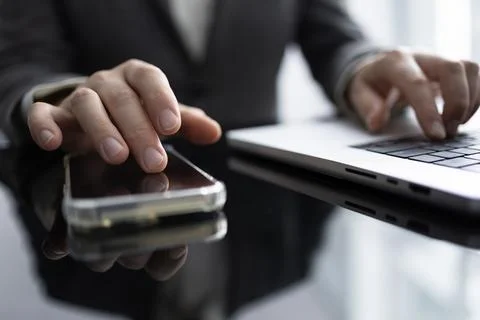 Business Communication Using Mobile and Laptop 写真素材