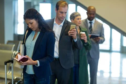 Business commuters waiting in queue Stock Photos