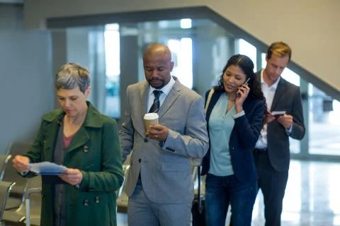 Business commuters waiting in queue Stock Photos