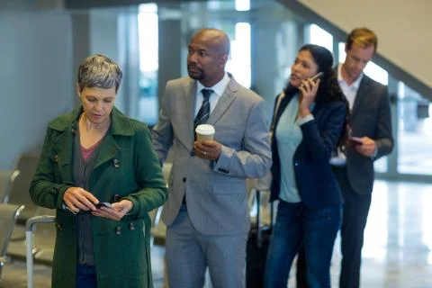 Business commuters waiting in queue Stock Photos