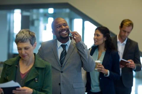 Business commuters waiting in queue Stock Photos